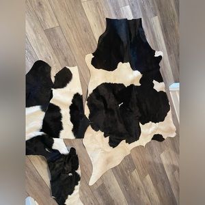 25 square foot cowhide rug and two throw pieces